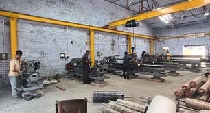 Manufacturing facility with heavy machinery and staff
